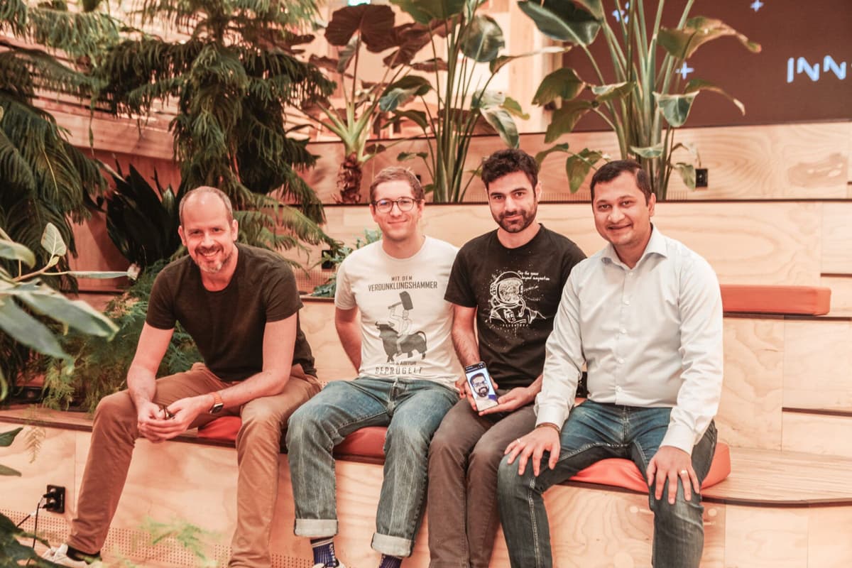Image of Morten Helgaland, Matthias Schedel, Maroof Mushtaq holding a picture of Bikash Agrawal and Antorweep Chakravorty